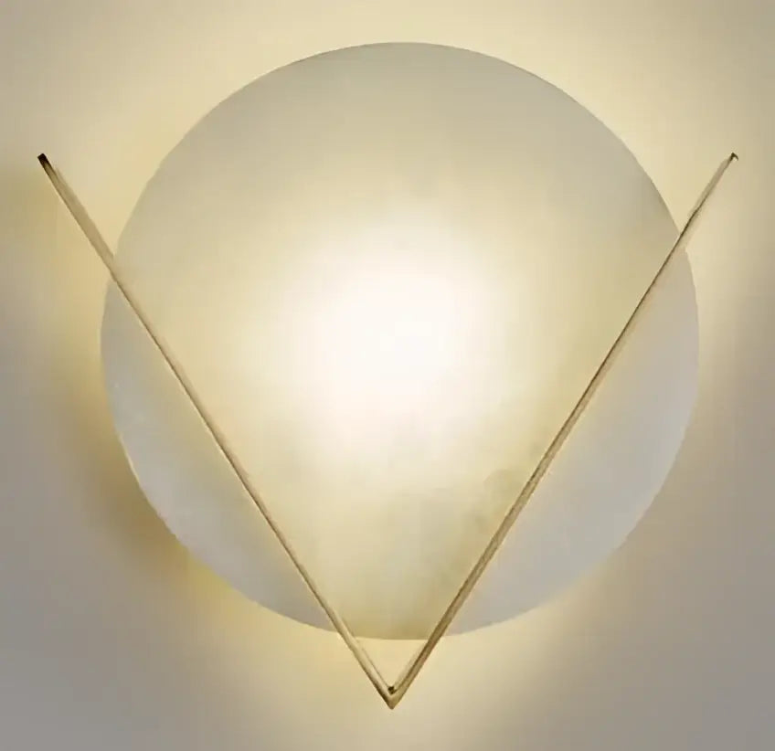 Vintage brass ceramic wall lamp with knob switch featuring a modern frosted glass globe and gold triangular frame by decorbites ceramic wall