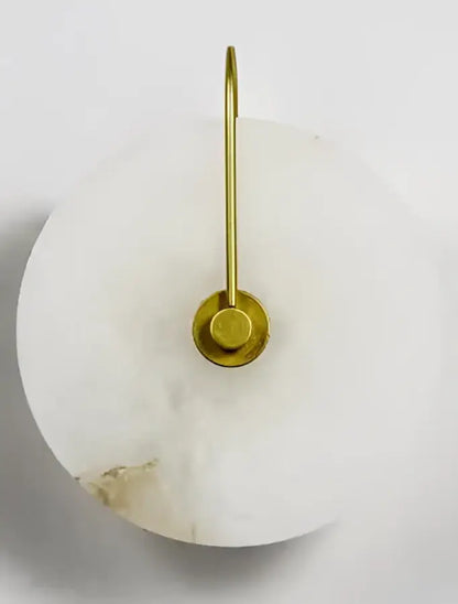 A sleek white marble ceramic wall lamp with polished brass hook and base vintage brass decorbites ceramic wall lamp