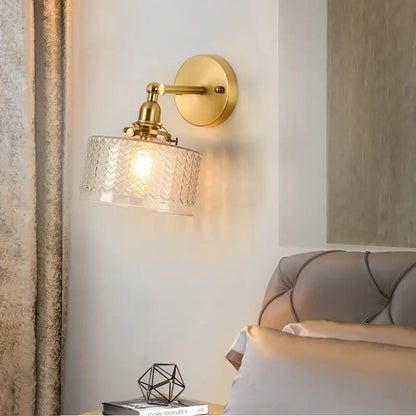 Gold-finished vintage brass led wall lamp with clear glass chevron textured shade for bedroom sconce lighting