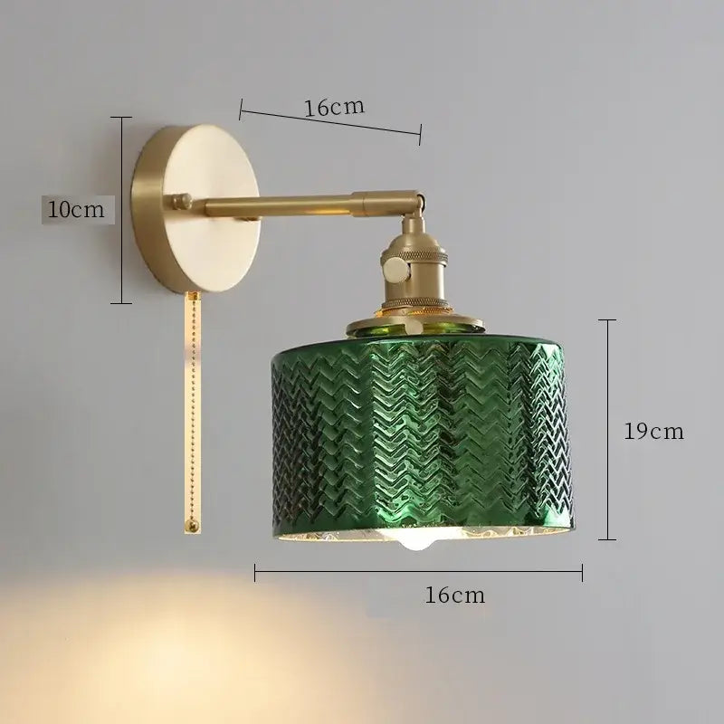 Vintage brass clear glass wall light with green textured chevron pattern and brass-finished metal arm decorbites clear glass