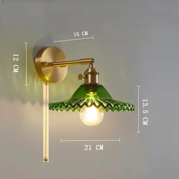 Vintage brass wall light with emerald green scalloped clear glass shade and ribbed metal arm for bedroom decorbites clear glass