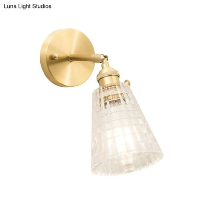 Vintage brass clear ribbed glass wall sconce with intricate grid pattern designed for led incandescent lighting in bedroom
