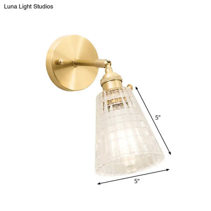 Vintage brass clear ribbed glass wall sconce with intricate grid pattern suitable for led incandescent lighting