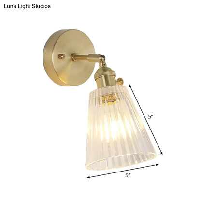 Vintage brass clear ribbed glass wall sconce featuring a brass finish and led incandescent fluorescent compatible light