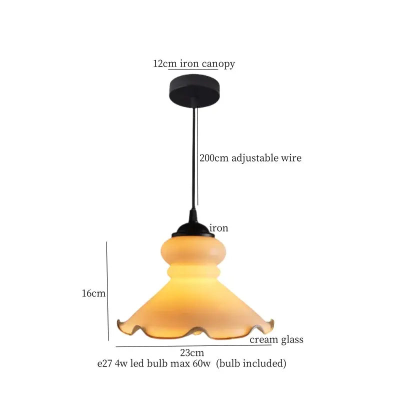 Cream-colored translucent glass LED pendant light with fluted edge and black iron canopy for dining room decorbites cream glass