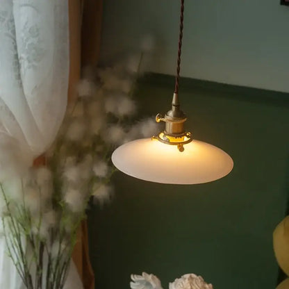 Vintage brass cream glass led pendant light with warm-toned frosted glass and twisted brown cord for dining room decorbites cream glass