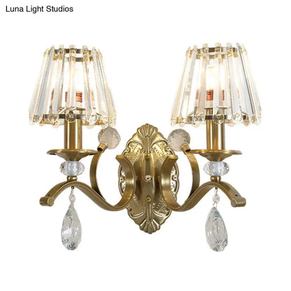 Vintage brass crystal fringe wall sconce with gold-toned finish, two chandelier-style shades, and e14 bulb base light type