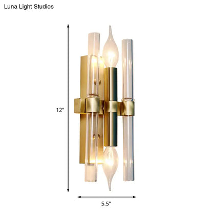 Vintage brass finish candle wall sconce in gold tone with clear glass tubes and central cylindrical accent for living room decor