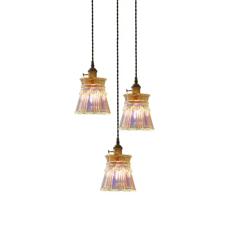 Three vintage-style brass fluted glass led pendant lamps with iridescent shades for dining room lighting