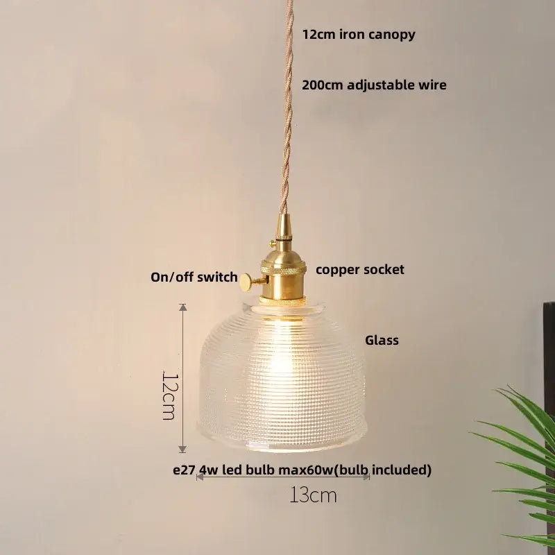A warm-glowing vintage brass glass led pendant lamp with a textured dome for dining room floral lighting