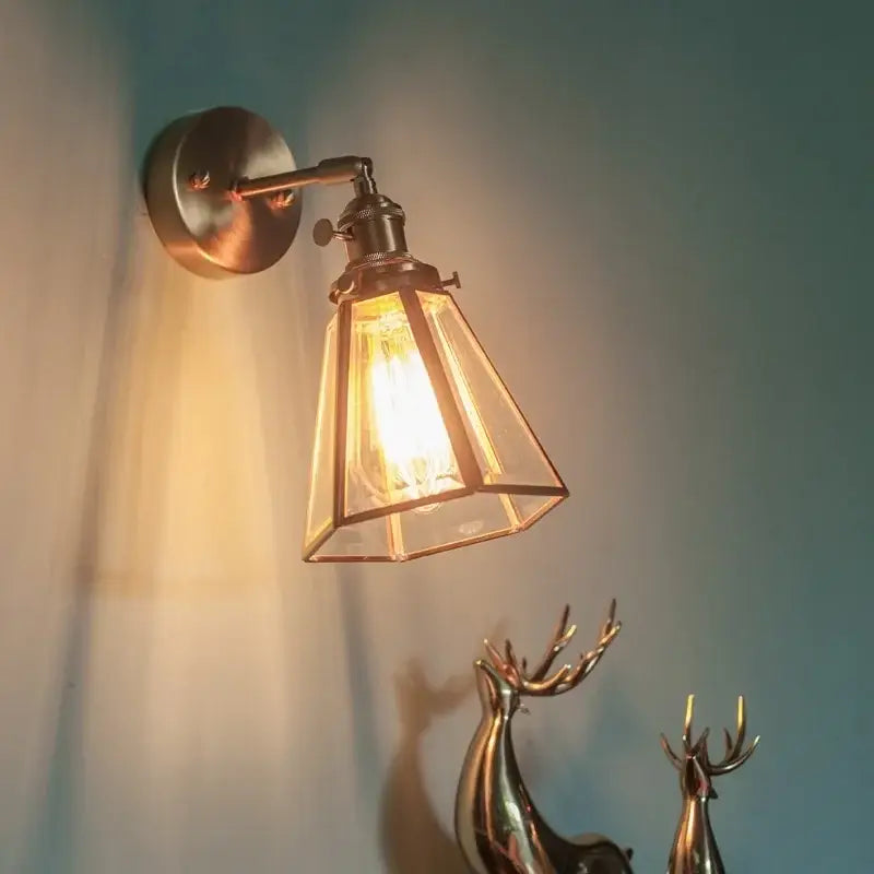 Vintage brass glass led wall light with geometric shade designed as a bathroom mirror sconce from decorbites brass glass