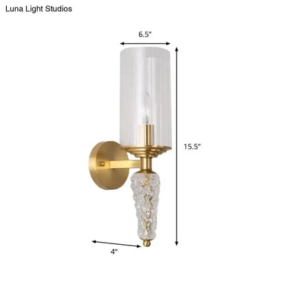 Vintage brass wall mounted lighting fixture with gold finish, clear textured glass base, and frosted glass shade