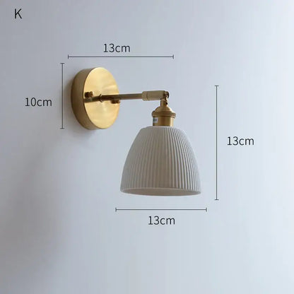 Vintage brass wall sconce with a copper arm led and off-white ribbed ceramic lampshade for bedroom decorbites copper arm