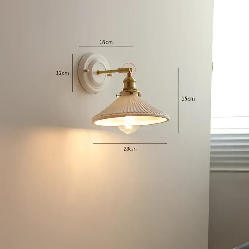 Vintage brass globe wall sconce with cream ribbed glass shade and brass-finished metal arms for decorbites copper arm led lighting