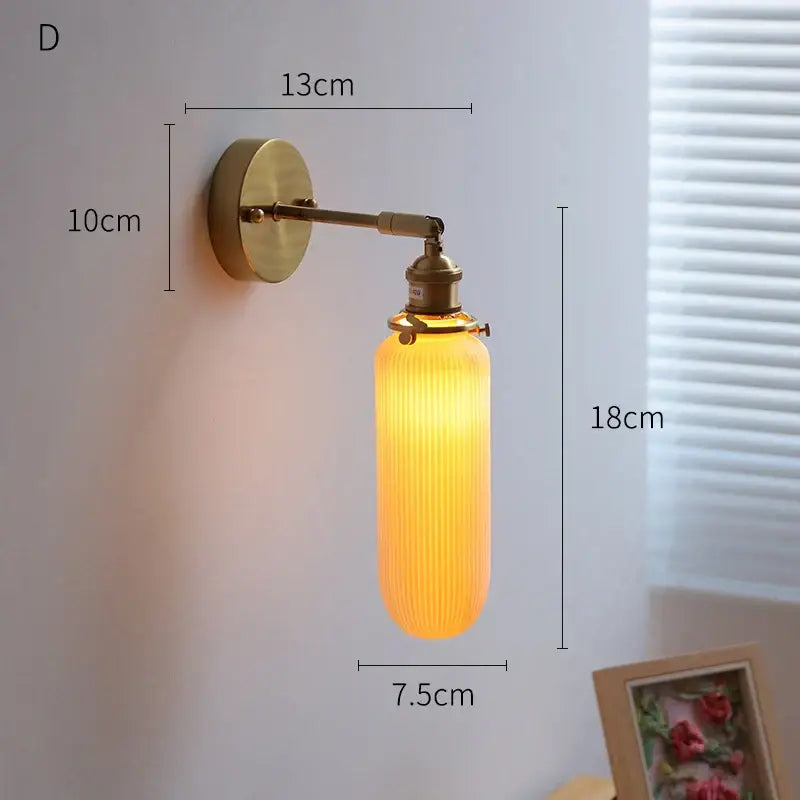 Vintage brass globe wall sconce with warm amber ribbed glass shade and decorbites copper arm led for bedroom lighting