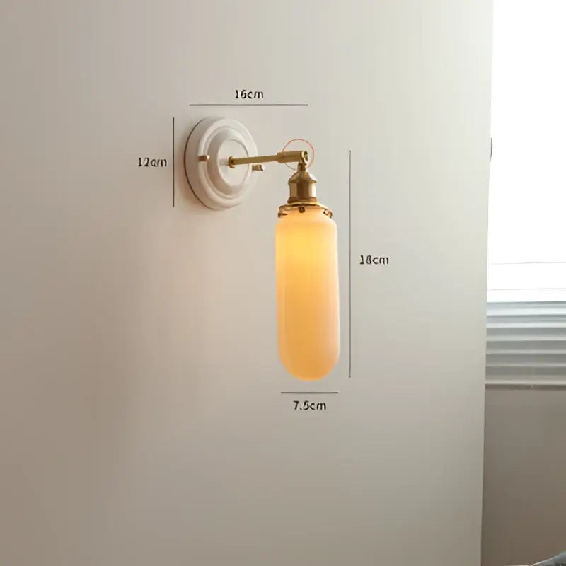 Vintage brass globe wall sconce with warm amber ribbed glass shade featuring decorbites copper arm led design
