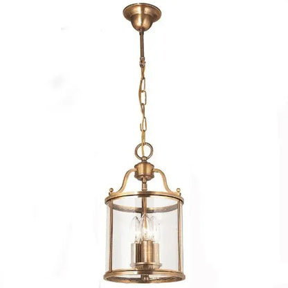 Antique brass pendant light with clear glass panels and chain suspension helps create vintage dining room ambiance with led bulbs