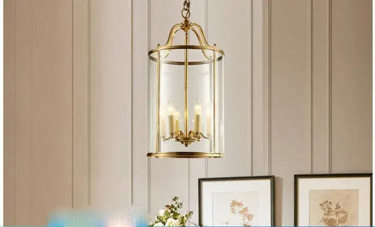 Vintage brass pendant light with clear glass panels and four led bulbs helps create warm dining room ambiance