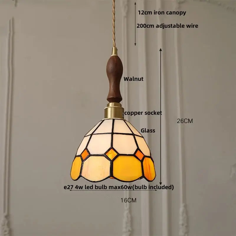 Vintage brass led pendant light featuring a tiffany-inspired stained glass shade with cream amber yellow and walnut canopy
