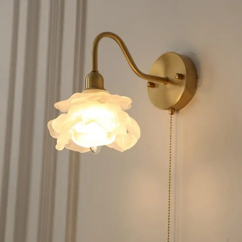 Vintage brass led wall light with warm-toned brass finish and off-white ceramic rose shade for bedroom decorbites brass led wall