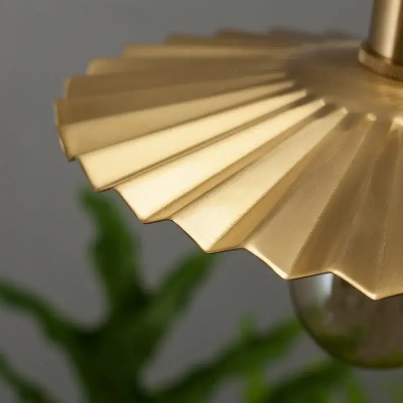 Golden brass pleated led pendant light with fan-shaped lampshade for dining room decorbites brass pleated design