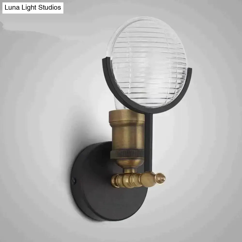 Vintage brass ribbed glass led wall lamp sconce with black metal base and clear ribbed glass globe for bedroom