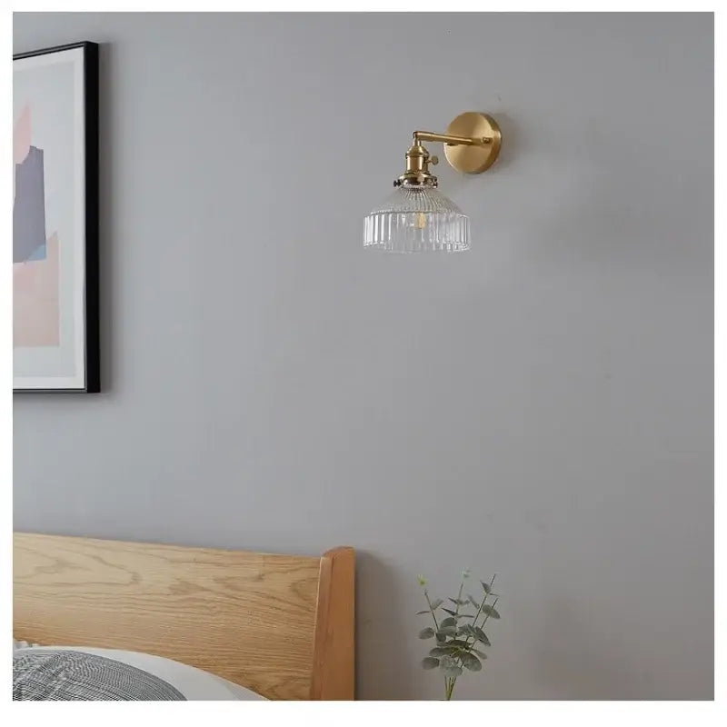 Gold-toned vintage brass wall lamp with clear ribbed glass pull chain shade for living room pull chain led lighting