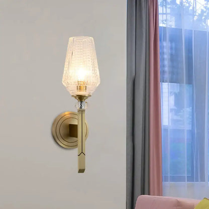 Vintage brass wall light with ribbed textured glass shade, a stylish bedroom sconce fixture measuring inches fixture