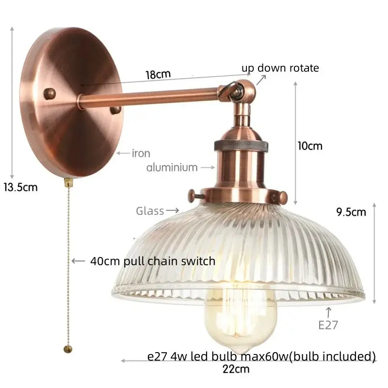 Vintage brass wall sconce with copper finish ribbed glass shade and pull chain switch for bedroom lighting