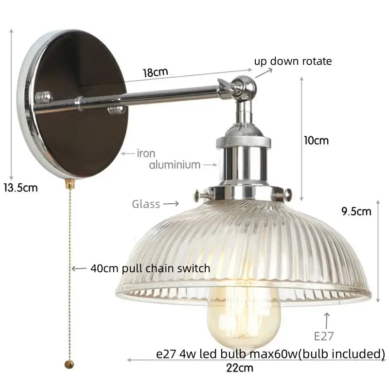 Industrial-style wall sconce with polished chrome finish, adjustable arm, ribbed glass shade, and pull chain switch