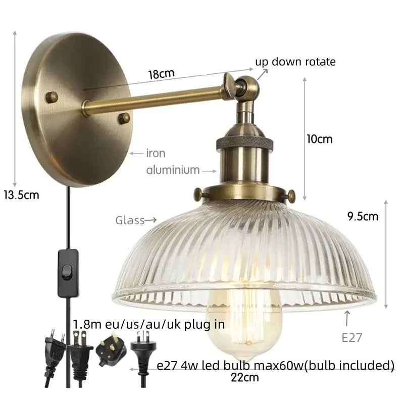 Antique brass wall sconce with ribbed glass shade and adjustable arm featuring a pull chain switch for bedroom light