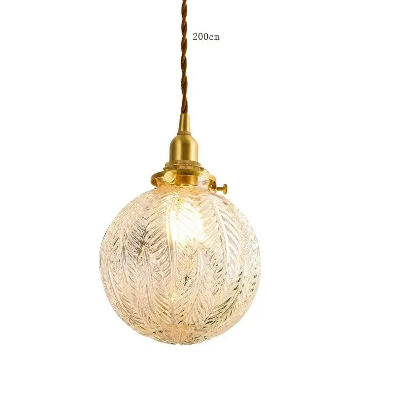 Vintage brass scalloped glass led pendant lamp featuring a clear spherical pendant light with textured leaf pattern