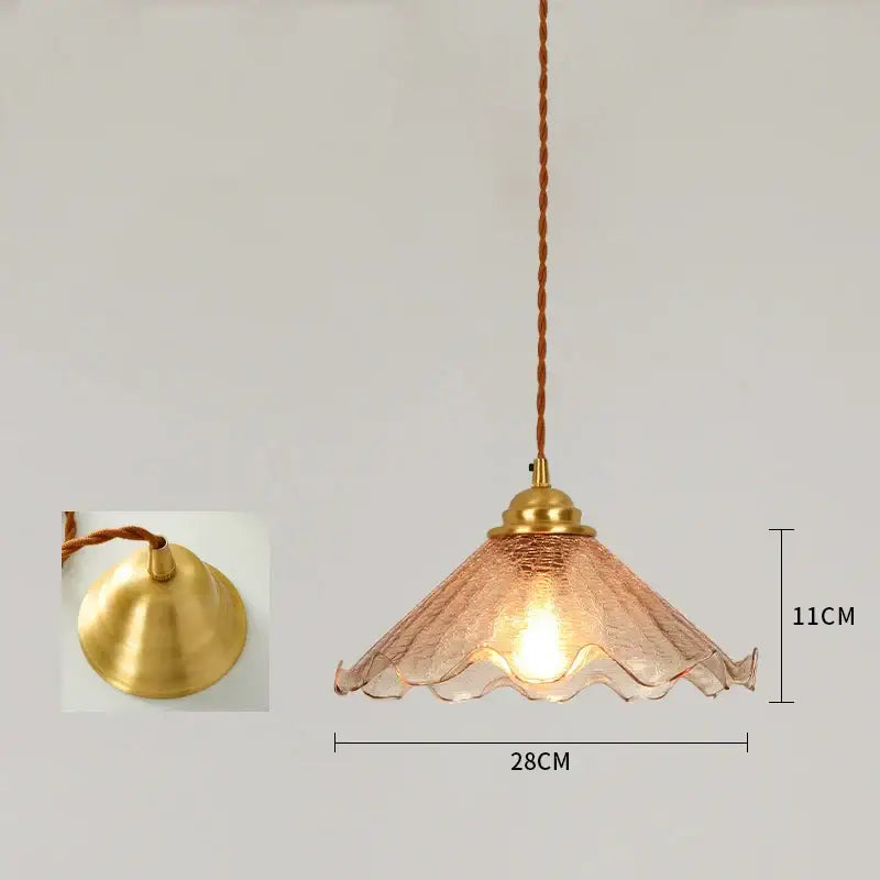 A warm-toned vintage brass scalloped glass led pendant lamp with a twisted cord for bedroom lighting