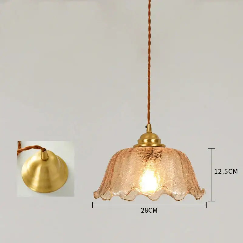 A warm-toned vintage brass scalloped glass led pendant lamp with textured glass and twisted cord for bedroom lighting