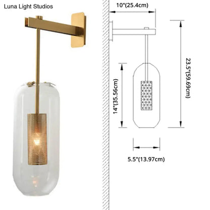 Vintage brass wall lamp with clear glass cylinder shade and illuminated brass mesh interior for living room use