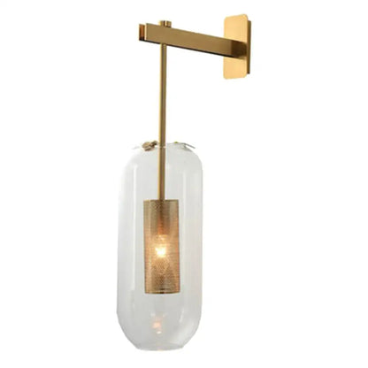 A vintage brass wall lamp with a clear glass cylinder shade and illuminated brass accent for living room use