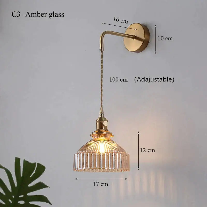 Vintage brass wall lamp with amber glass shade led and twisted cord for elegant living room lighting