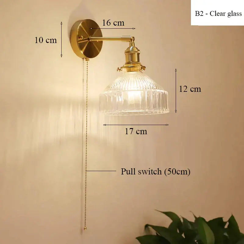 Vintage brass wall lamp with a clear ribbed glass shade and pull chain switch for living room lighting with glass shade led option
