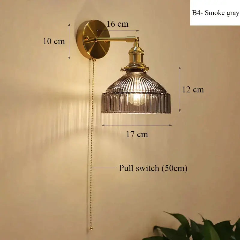 Vintage brass wall lamp with smoke gray ribbed glass shade and adjustable pull chain switch for living room use