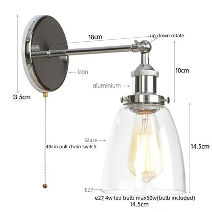 Vintage brass wall light fixture with polished chrome arm and iron mount featuring clear glass dome for bedroom use