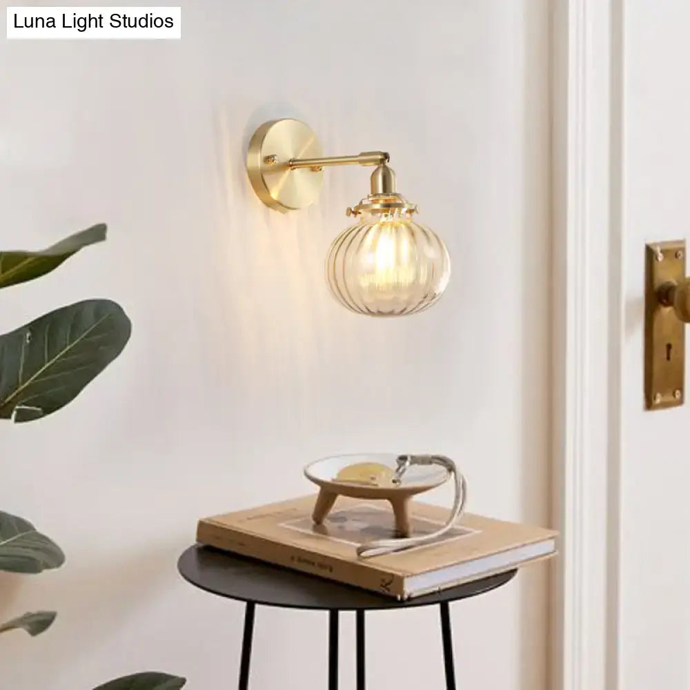 Vintage brass wall light with champagne clear ribbed glass shade designed for bedroom illumination
