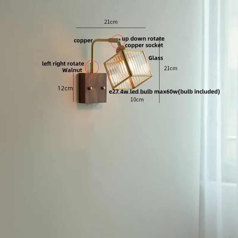 Vintage brass wall light with copper and walnut finish featuring a decorbites clear glass cube shade for bedroom decor