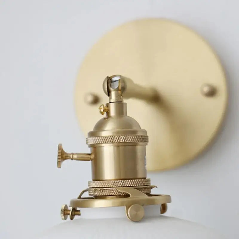 Vintage brass wall light with ribbed glass, brass finish, knob switch, and circular mounting plate for bedroom decorbites ceramic knob
