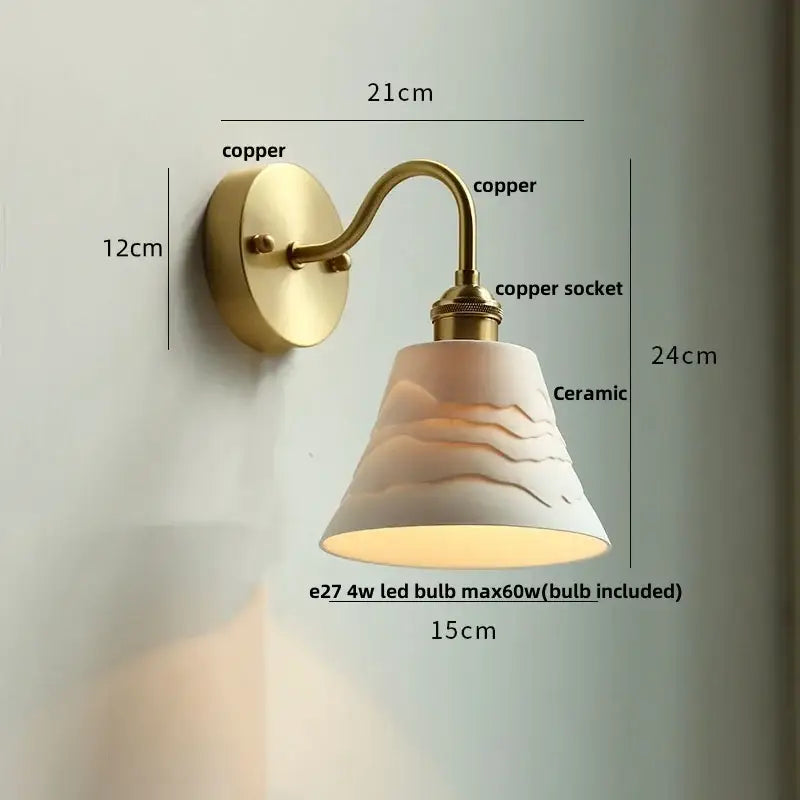Vintage brass wall sconce with warm-toned ceramic lampshade and decorbites clear glass mounted on copper fixture