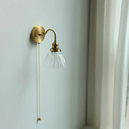 Vintage brass wall sconce with scalloped clear glass shade and ornate pull chain for stairway decorbites clear glass design