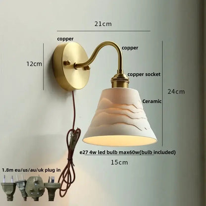 Vintage brass wall sconce with scalloped clear glass and white ceramic shade featuring wave patterns for stairways decorbites clear glass