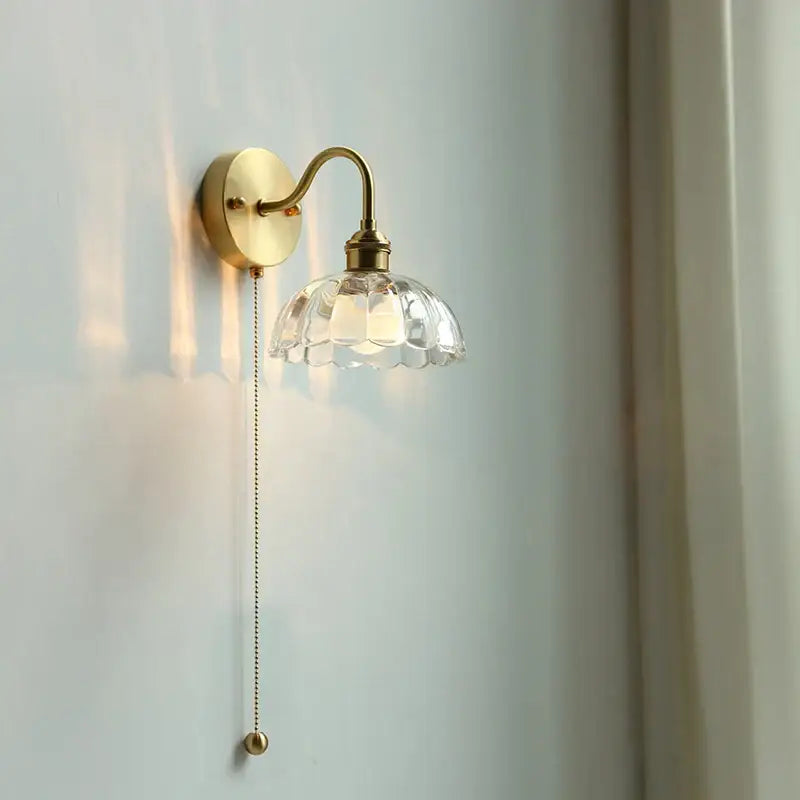 Vintage brass wall sconce with scalloped clear glass shade and ornate pull chain ideal for stairways decorbites clear glass