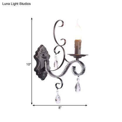 Antique bronze wrought iron wall mounted lamp with crystal teardrop pendants and candle-style bulb for living room