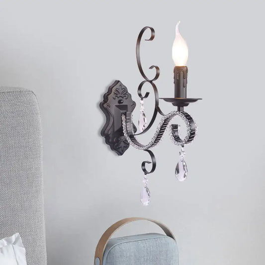 Antique bronze wrought iron wall mounted lamp with crystal teardrop pendants and candle style bulb for living room