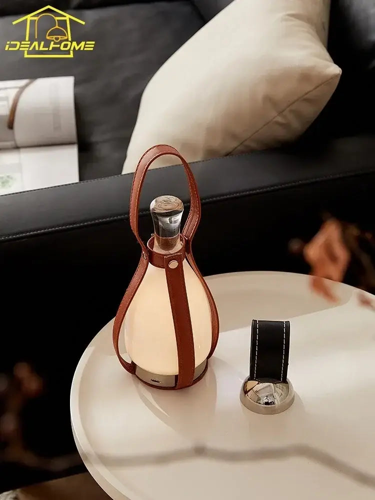 Warm-toned vintage brown leather grapefruit table lamp with sleek teardrop shape and metallic base for decorbites grapefruit table lamp